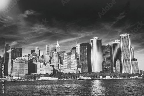 Amazing sunset colors of Lower Manhattan skyline from the ferry boat  New York City