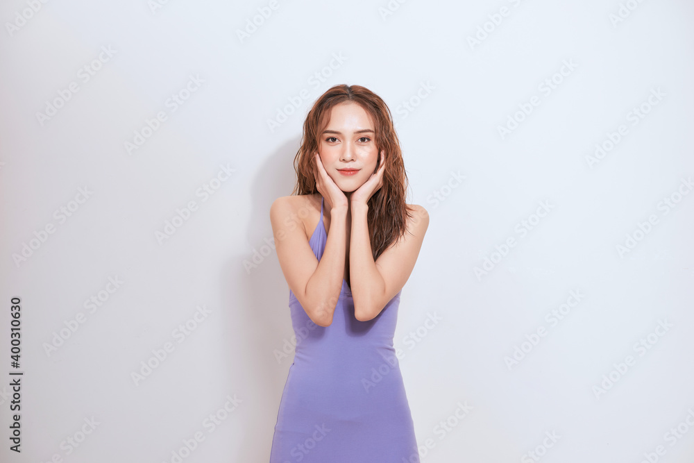 Portrait of beautiful woman smiling and touching her face with hands isolated over white backgroun Portrait of beautiful woman smiling and touching her face with hands isolated over white backgroun