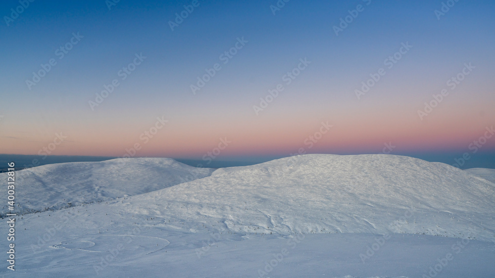 Midwinter in Pallastunturi, a group of seven fells in Pallas-Yllästunturi National Park of Finnish Lapland. In a clear day while the sun doesn't rise above horizon there is nevertheless lovely light. Midwinter in Pallastunturi, a group of seven fells in Pallas-Yllästunturi National Park of Finnish Lapland. In a clear day while the sun doesn't rise above horizon there is nevertheless lovely light.