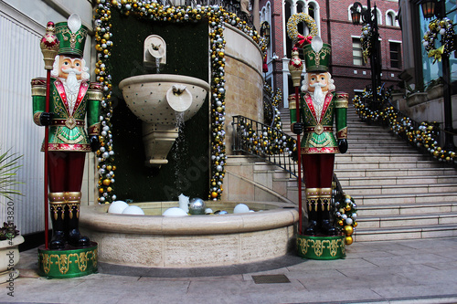 Сhristmas decorations on the eve of the holidays. Tin soldiers as Christmas decorations in front of the entrance to the entertainment center.