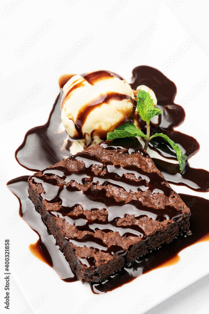 vegan chocolate brownie dessert with dairy-free vanilla ice cream vegan chocolate brownie dessert with dairy-free vanilla ice cream
