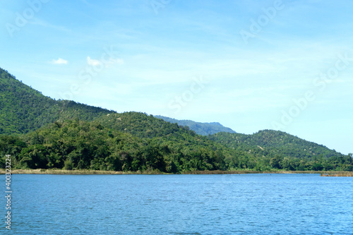 Landscape of the beautiful scenic view of the river over the mountain with blue sky with clouds above as the background in the summer