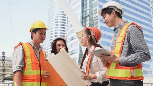 Group of civil engineer team with safety protection in work site area meeting together and finish success to planning and discuss detail