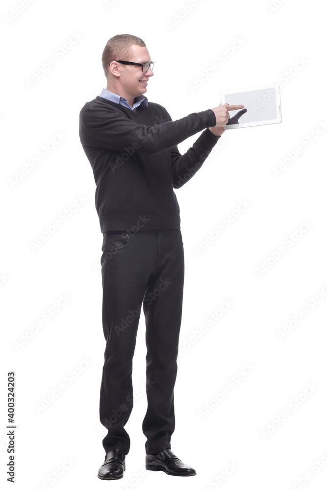 Cheerful young man wearing glasses pointing on blank screen tablet Cheerful young man wearing glasses pointing on blank screen tablet
