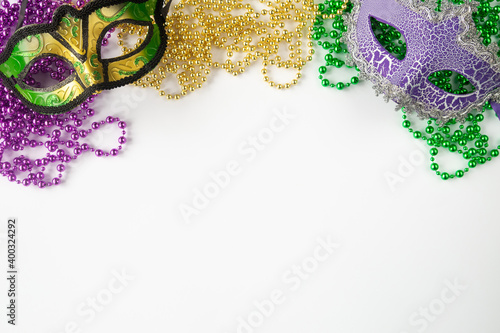 Fototapete Mardi gras background on white with masks and beads and copy space