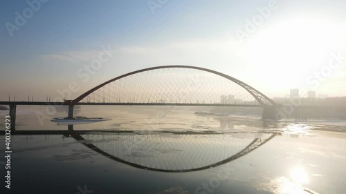 distant plan of the Bugrinsky bridge from aerial photography. Bridge against the setting sun photo