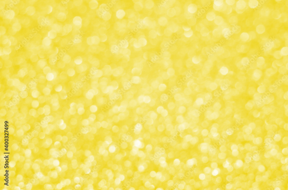 Illuminating Pantone Color Of The Year 2021. Abstract festive bokeh background with shining defocus sparkles. Blurred glitters shimmering dust macro close up, copy space for text logo Illuminating Pantone Color Of The Year 2021. Abstract festive bokeh background with shining defocus sparkles. Blurred glitters shimmering dust macro close up, copy space for text logo