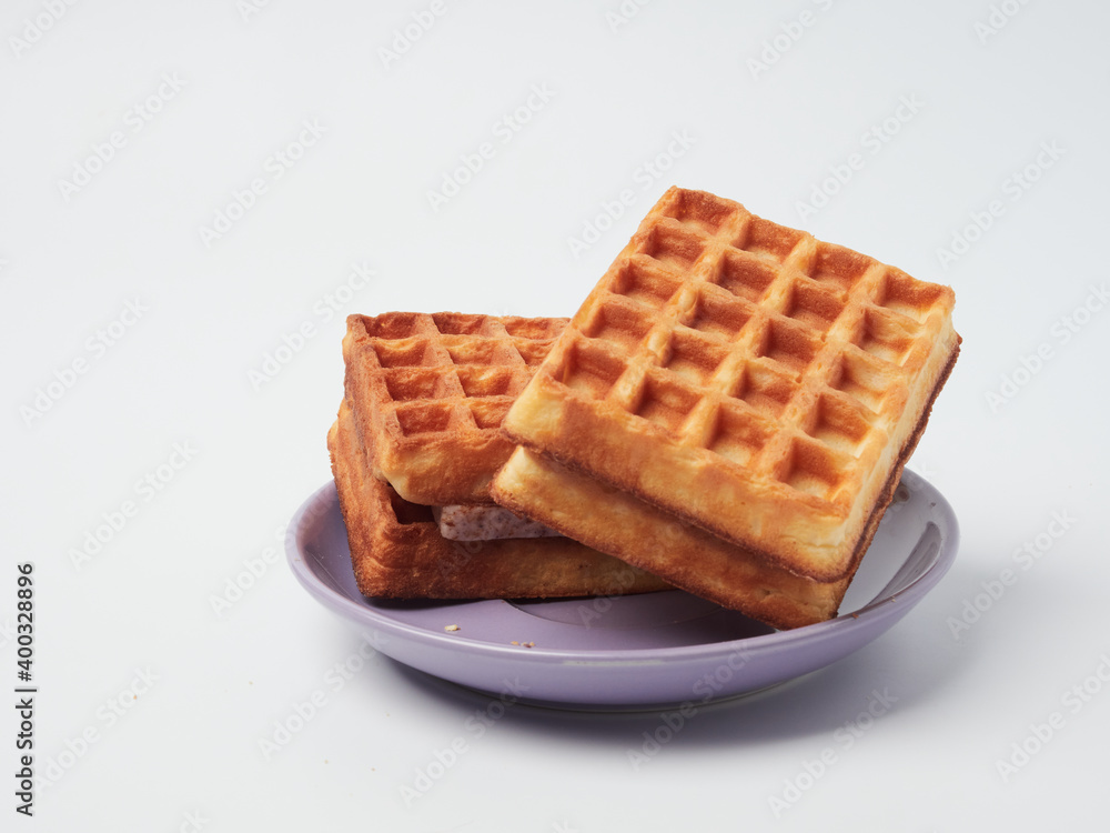 Traditional Belgian waffles isolated on white background, top view Traditional Belgian waffles isolated on white background, top view