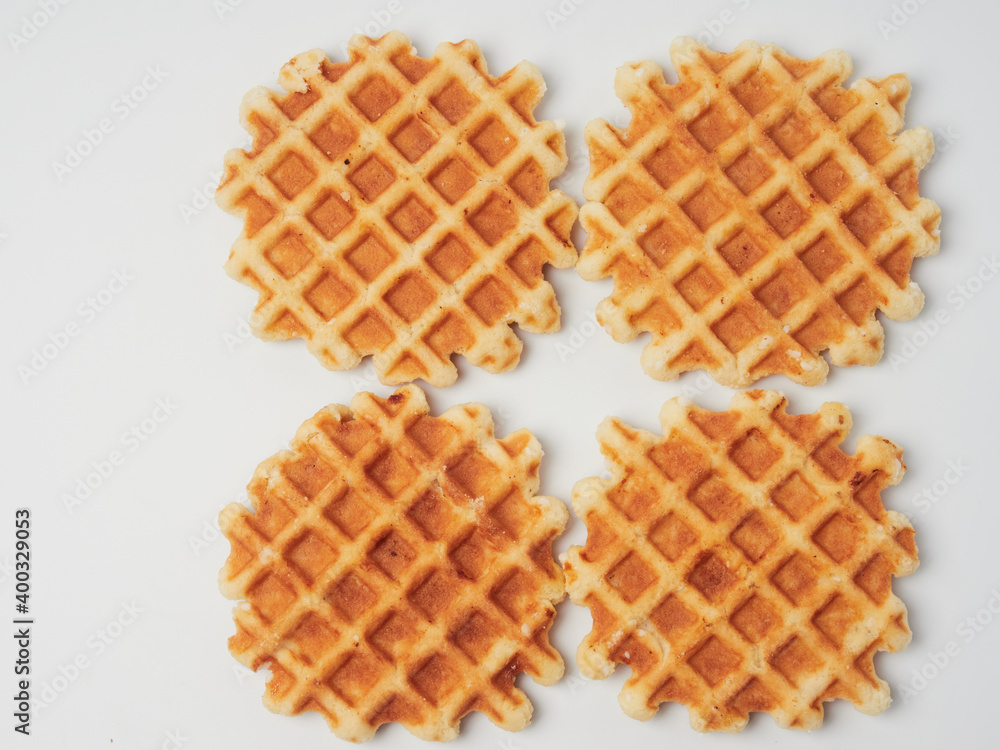 Traditional Belgian waffles isolated on white background, top view Traditional Belgian waffles isolated on white background, top view