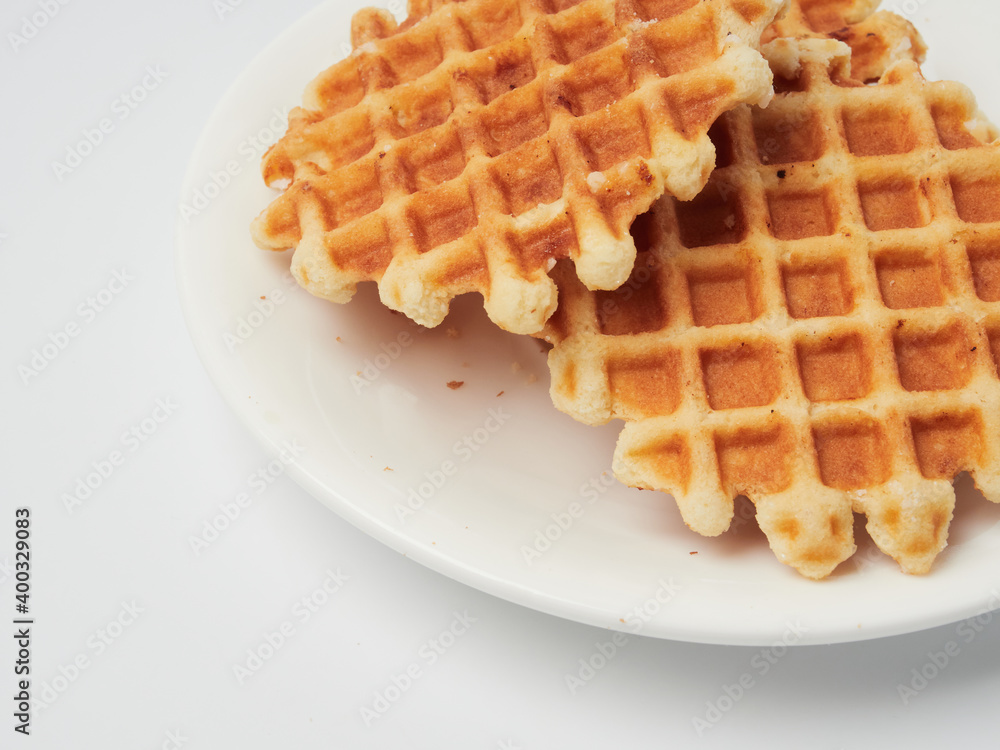 Traditional Belgian waffles isolated on white background, top view Traditional Belgian waffles isolated on white background, top view