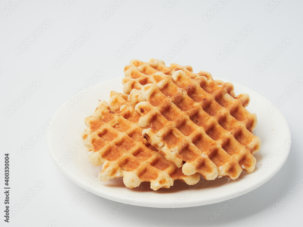 Traditional Belgian waffles isolated on white background, top view Traditional Belgian waffles isolated on white background, top view