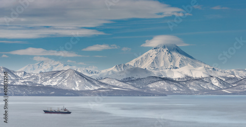 Kamchatka, frosty morning in the water area of Avacha Bay, Vilyuchinsky volcano in the background. © Alexander