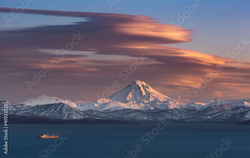 Kamchatka, lenticular clouds over the Vilyuchinsky volcano and the water area of Avachinsky bay