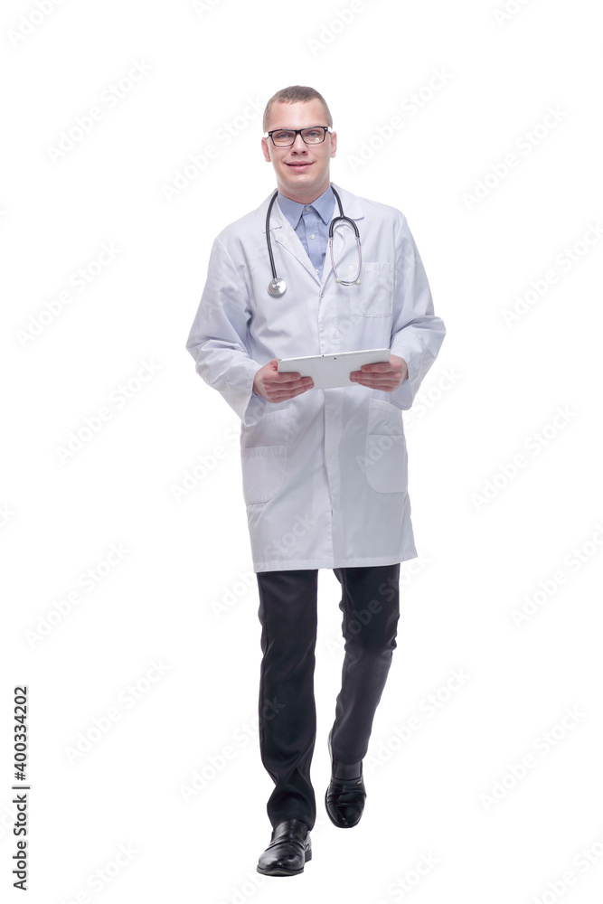 Portrait of male doctor walking and using digital tablet on white background. Portrait of male doctor walking and using digital tablet on white background.
