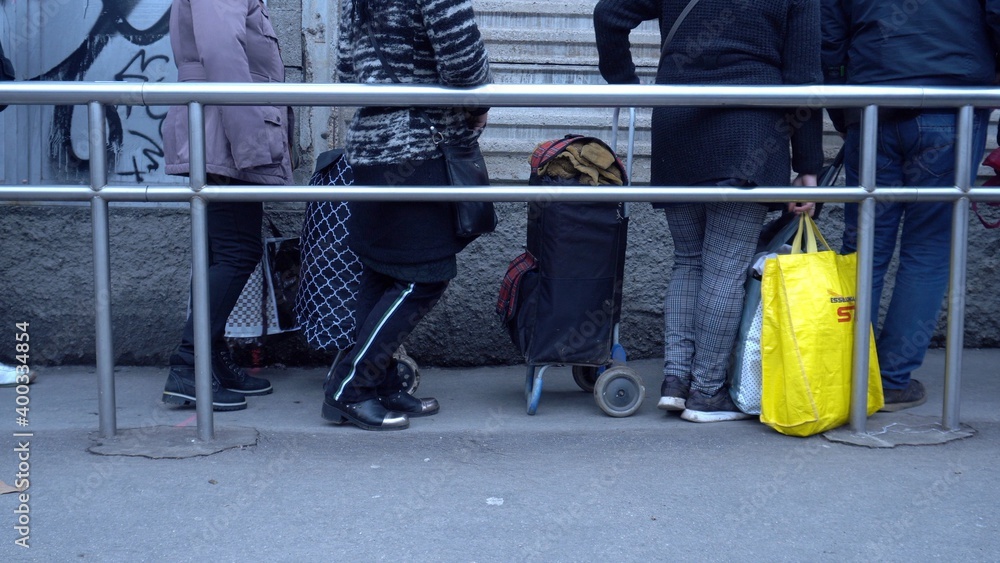 Europe, Italy , Milan December 2020, poor Italian and foreign people with masks lined up at Pane Quotidiano for free food during Covid-19 Coronavirus, increase in unemployed people and economic crisis