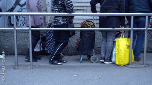 Obraz na płótnie Europe, Italy , Milan December 2020, poor Italian and foreign people with masks lined up at Pane Quotidiano for free food during Covid-19 Coronavirus, increase in unemployed people and economic crisis w salonie