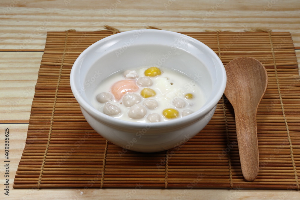 Chinese rice balls in sweet coconut milk. Pumpkin and Taro glutinous rice balls in the bowl. Dessert in Traditional Chinese festival (Dongzhi Festival) concept. Famous recipe in New Year ceremony. Chinese rice balls in sweet coconut milk. Pumpkin and Taro glutinous rice balls in the bowl. Dessert in Traditional Chinese festival (Dongzhi Festival) concept. Famous recipe in New Year ceremony.