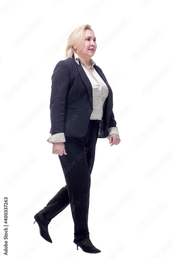 Happy business woman walking towards camera and smiling Happy business woman walking towards camera and smiling
