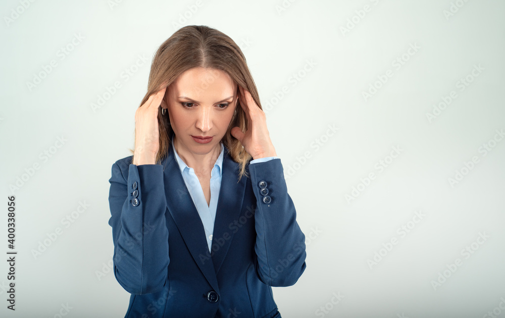 Young business lady with far away loook isolated on grey background Young business lady with far away loook isolated on grey background
