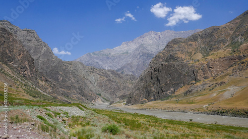 Beautiful landscape view of the Panj river valley bordering Afghanistan in Darvaz district, Gorno-Badakshan, the Pamir region of Tajikistan © Cyril Redor