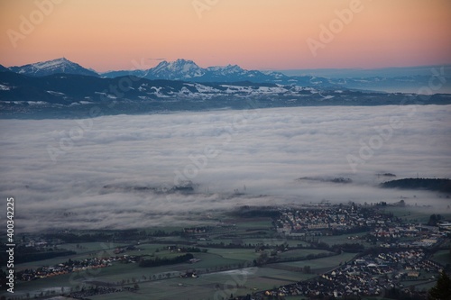Morning mist view from Bachtel Tower, Zurich Oberland, to the Swiss Alps with a sea of fog over the lake of Zurich Switzerland
