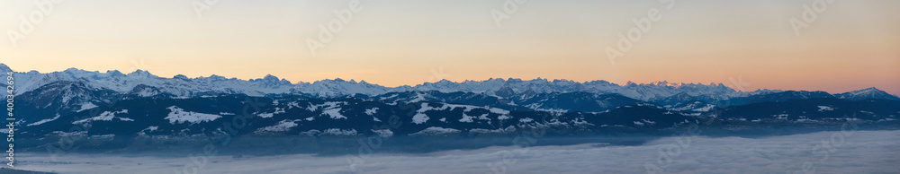 Morning mist view from Bachtel Tower, Zurich Oberland, to the Swiss Alps with a sea of fog over the lake of Zurich Switzerland