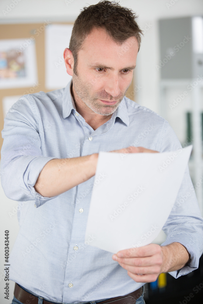 mature worker making complete list mature worker making complete list