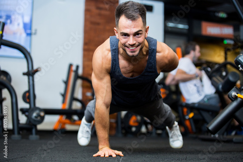 sportsman doing plank with one hand