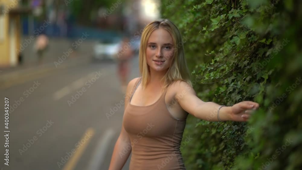 Beautiful girl at the green fence Beautiful girl at the green fence