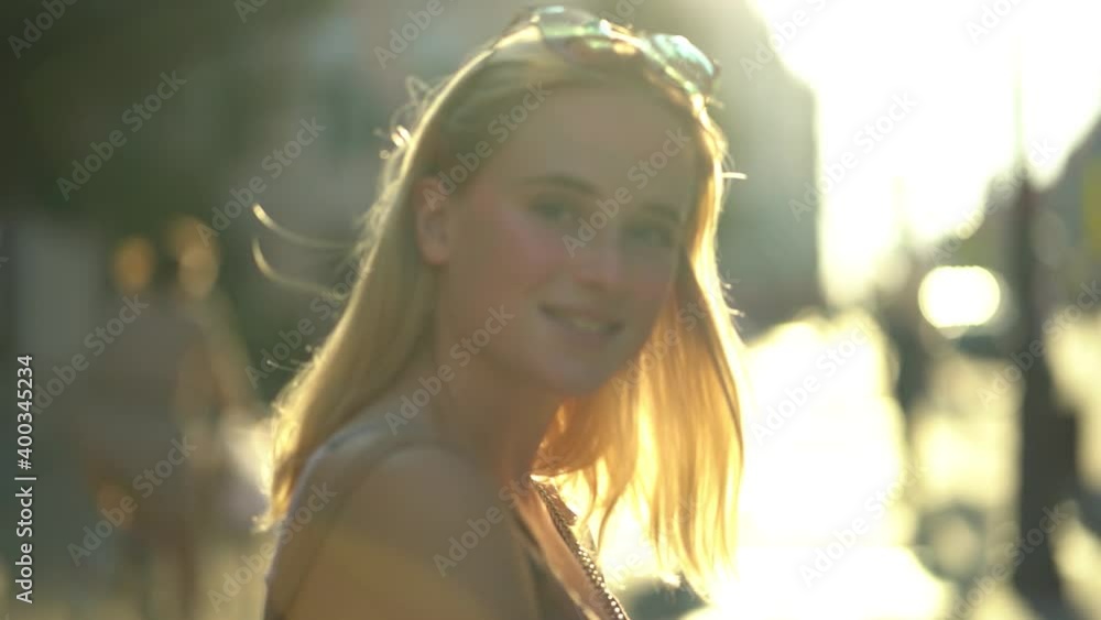 Beautiful girl on the background of the cityscape. Slow motion Beautiful girl on the background of the cityscape. Slow motion
