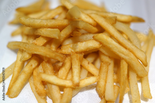 Close-up of French Fries on a table in a fast-food restaurant.
