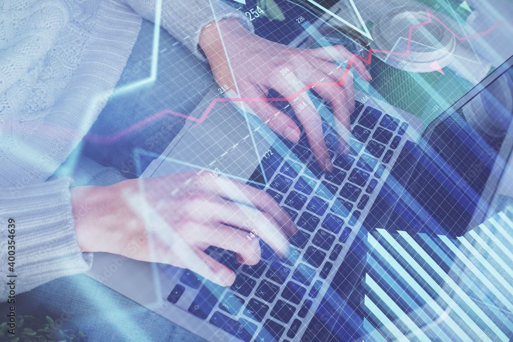 Double exposure of woman hands typing on computer and forex chart hologram drawing. Stock market invest concept. Double exposure of woman hands typing on computer and forex chart hologram drawing. Stock market invest concept.