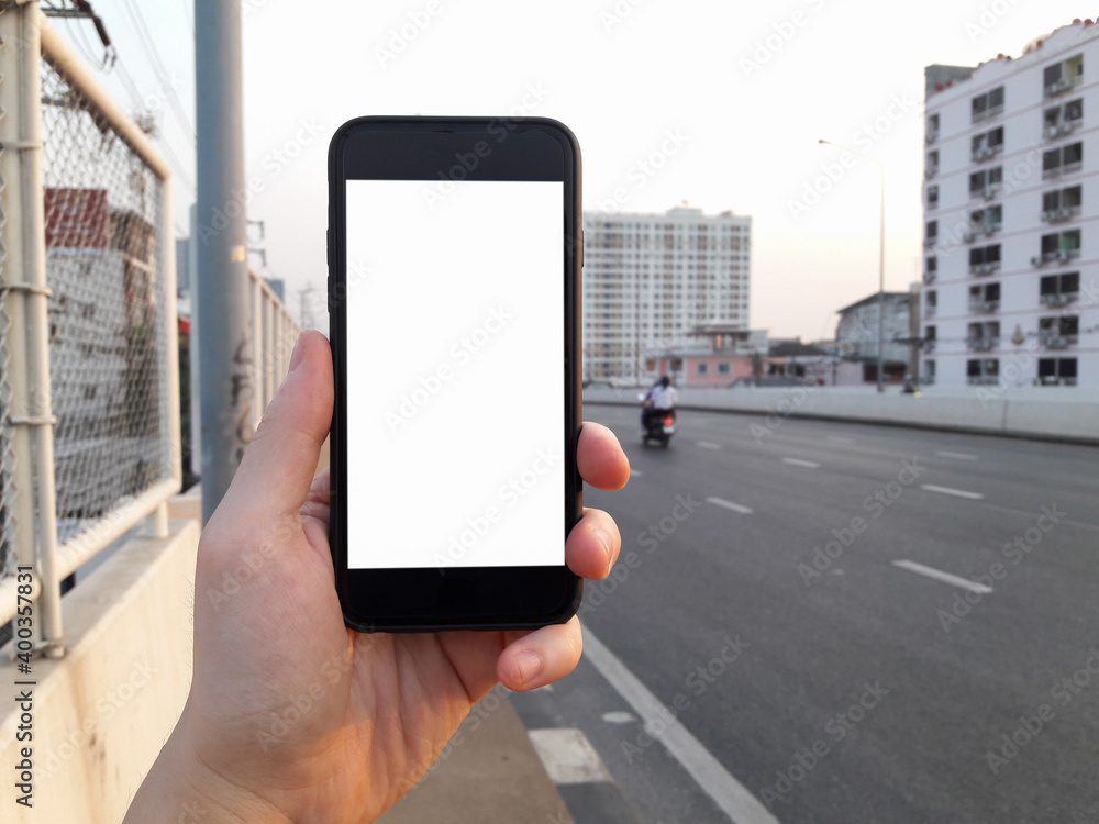woman hold mockup white smartphone blank display pointing finger on screen smartphone .mockup glitter street lifestyle , blured backdrop woman hold mockup white smartphone blank display pointing finger on screen smartphone .mockup glitter street lifestyle , blured backdrop