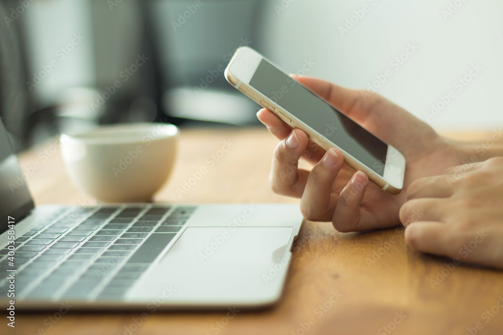 Close up of women's hands holding mobile phone with blank copy space screen for your advertising text message or promotional conten Close up of women's hands holding mobile phone with blank copy space screen for your advertising text message or promotional conten