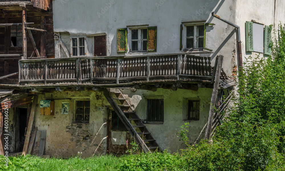 An old, deteriorating and abandoned house in Selva village, Gardena valley, Dolomites, South Tirol, Italy.