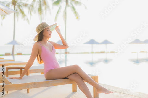 Portrait beautiful young asian woman relax leisure around outdoor swimming pool