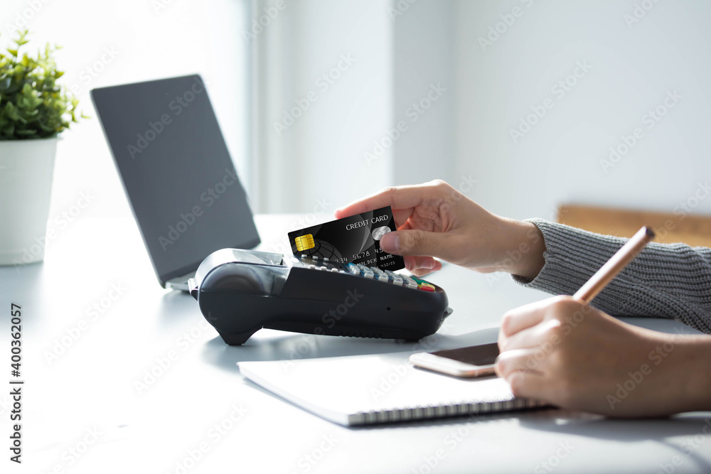 Hands holding  plastic credit card payment shopping with black credit card for Online payment