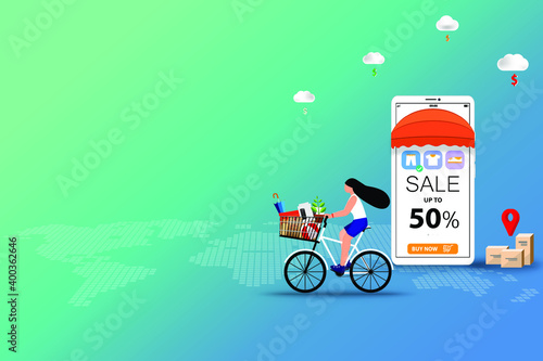 Concept of online shopping, young woman ride a bicycle to pick up the goods at store that already ordered from phone application to pick up at store in blue green shade background.