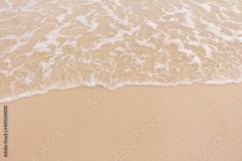 Soft smooth waves on the beach.