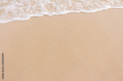 Soft beautiful wave on sandy beach. Background.