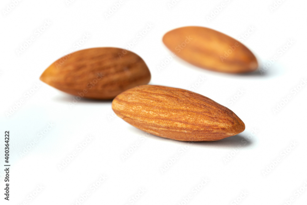 almond close up focus one almond depth of field isolated on the white background almond close up focus one almond depth of field isolated on the white background