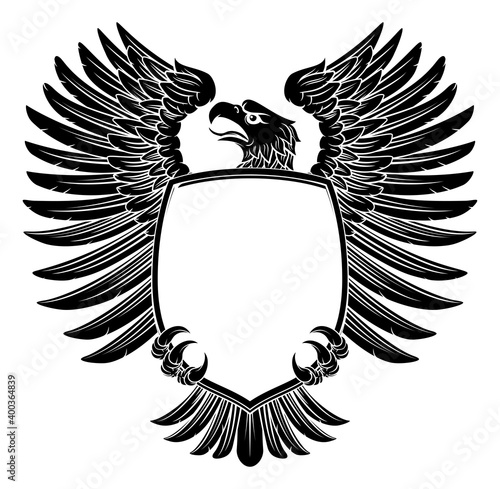 An eagle hawk or flacon shield design element in a vintage engraved woodcut style