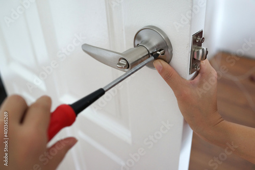 Photos Handyman install the new door lock in the room