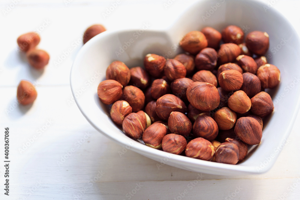 Fototapeta premium Hazelnut pieces on plate