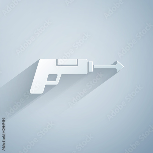 Paper cut Fishing harpoon icon isolated on grey background. Fishery manufacturers for catching fish under water. Diving underwater equipment. Paper art style. Vector.