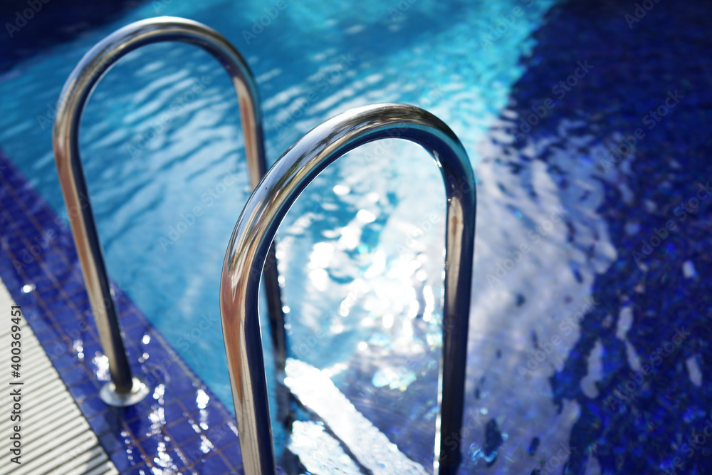 Grab bars ladder in the swimming pool Grab bars ladder in the swimming pool