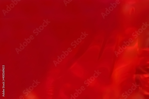 Abstract bright red background, close-up red glass.
