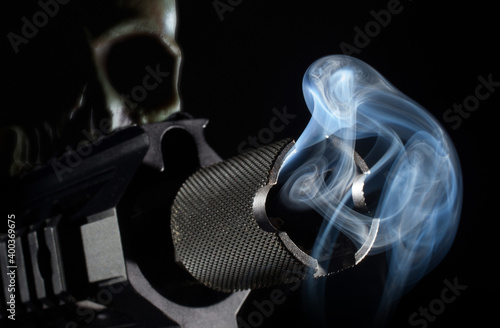 Ghost gun 3D rendering with a smoking gun barrel up front and skull slightly out of focus behind