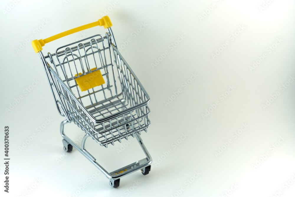 A smaller model of a shopping cart on a white background. A smaller model of a shopping cart on a white background.
