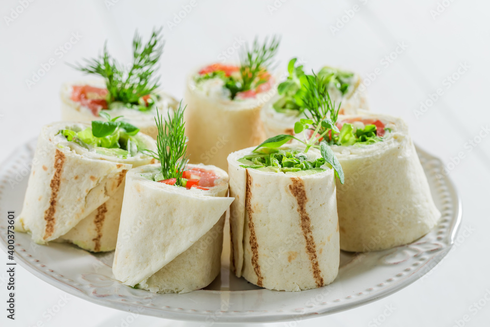 Tortilla with salmon, creamy cheese and vegetables